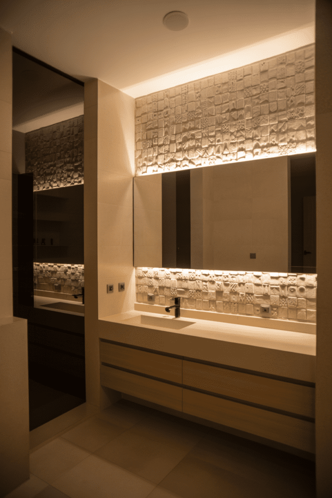 15 Bathroom Lighting Ideas That Make Every Bathroom Feel Better 0006 1 luxury bathroom featuring a textured sto ih13h4jqvt ivnemcnhptq y td5f0csu zijoa2q7fzg cover